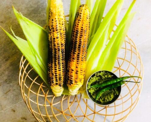 Fire cooked corn on the cob with spicy chilli-mint chutney